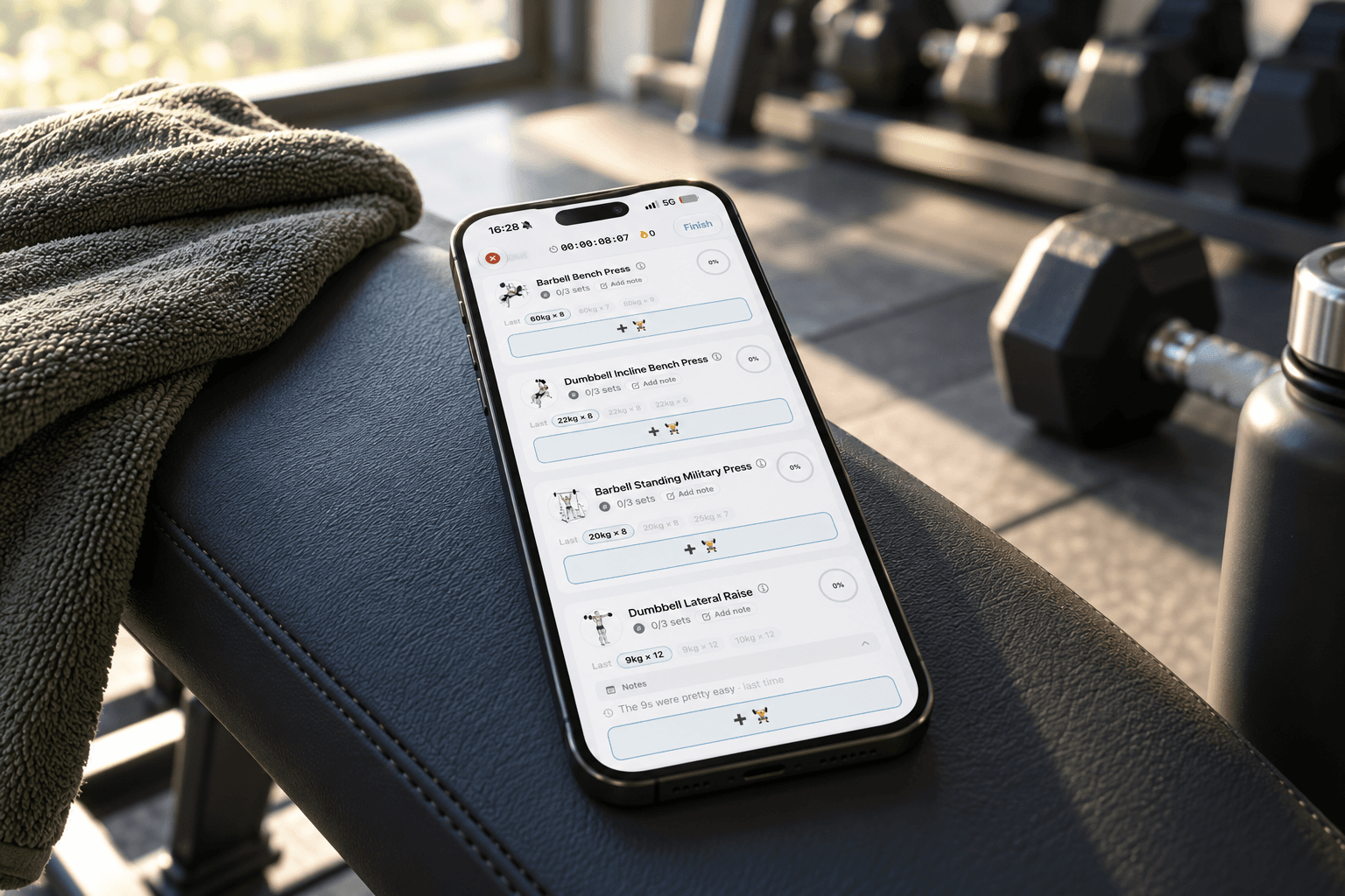 iPhone on a gym bench showing a clean workout log, a simpler alternative to JEFIT
